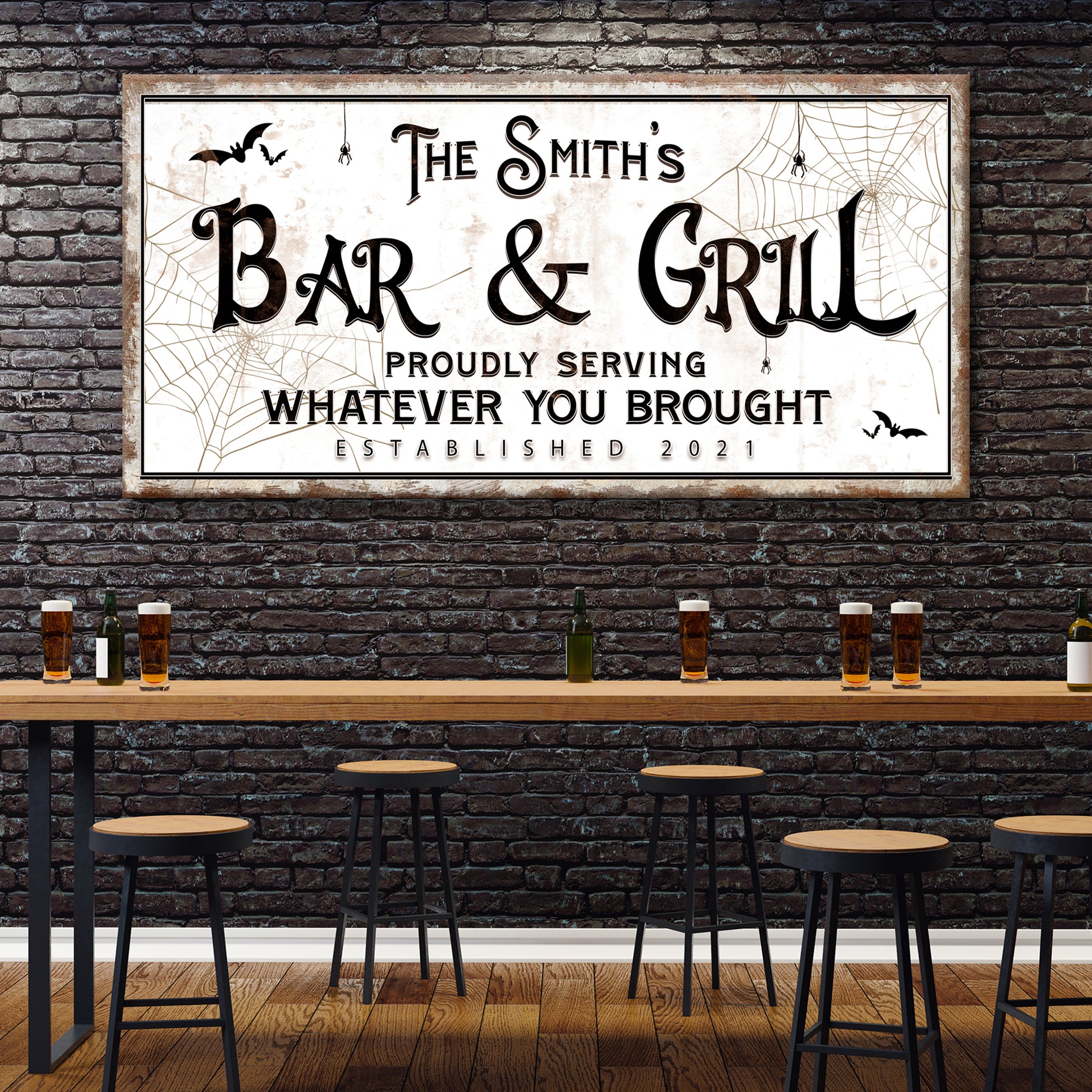 Tailored Canvases | Spooky Bar & Grill Halloween sign hung on the black brick wall of a rustic-themed bar.